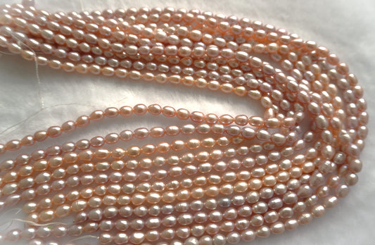 Freshwater pearl strands: pink oval 5.5-6×6.5-7.5mm lustrous rice pearls