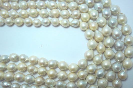 Freshwater pearl strands: Baroque white oval 10.5x13.5mm high grade