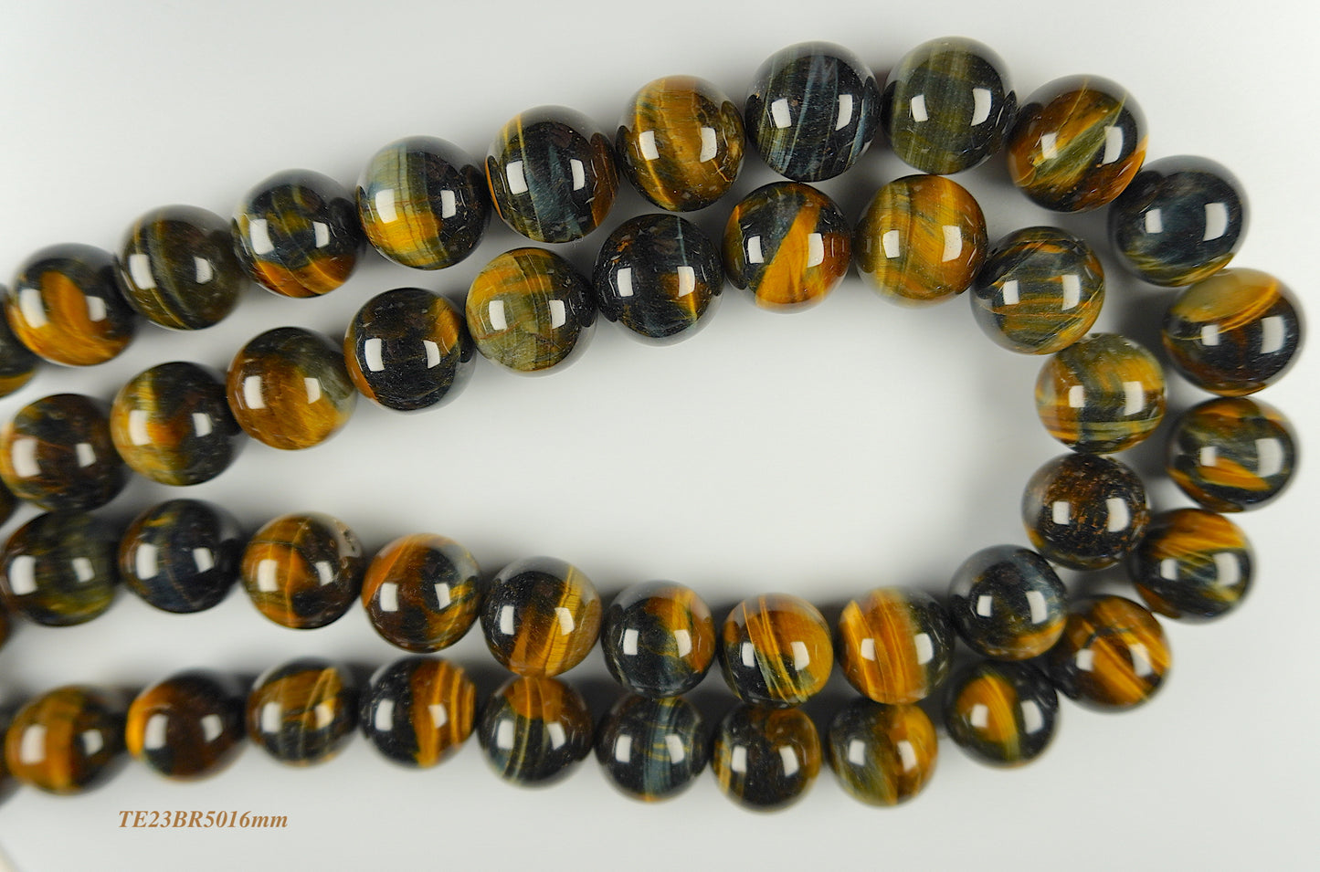 Tigers eye strands: Top grade natural brown/bluish round 16mm
