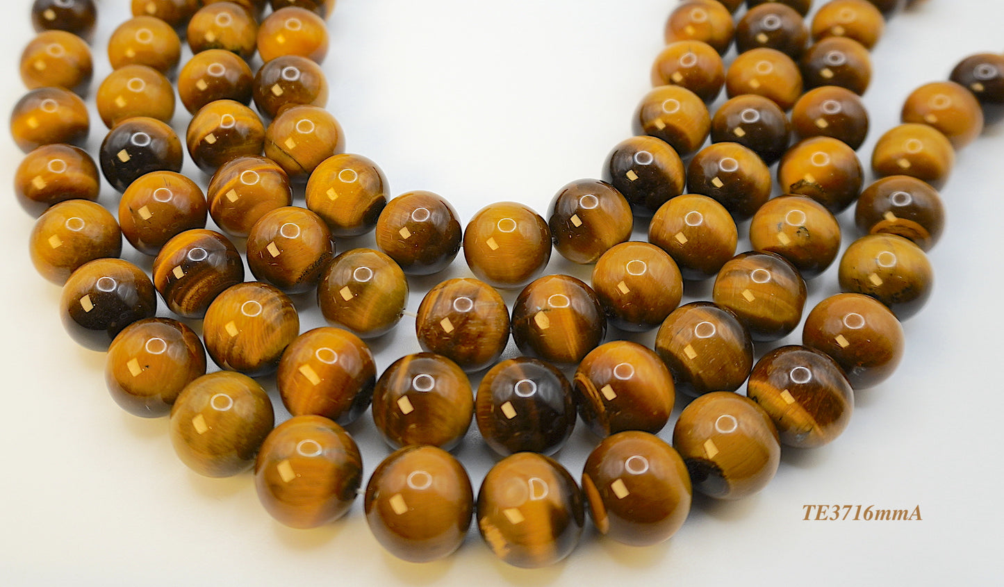 Tigers eye strands: Top grade natural brown round 16mm
