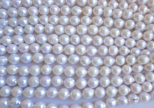 Freshwater pearl strands: Baroque white lustrous oval 13×11-11x10mm high grade