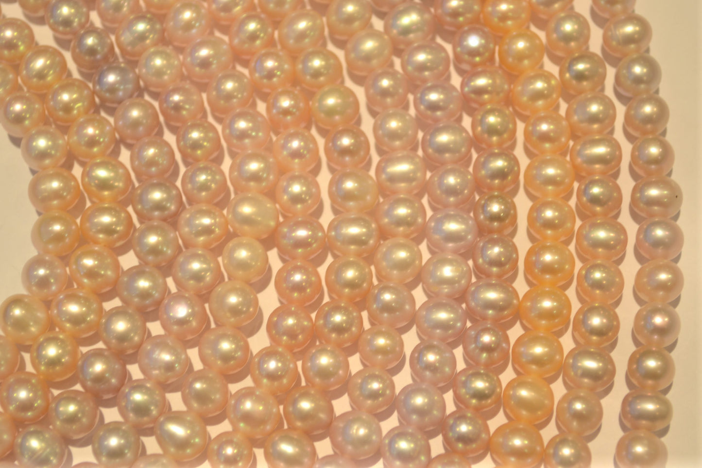 Freshwater pearl strands: pink roundish 8x9mm