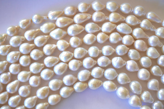 Freshwater pearl strands: Baroque white oval 12X10mm-14X10mm high grade