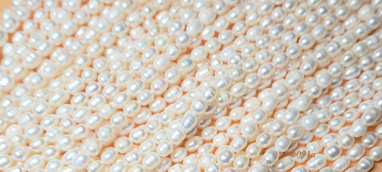 freshwater pearl strand: white oval pearls  7x9mm