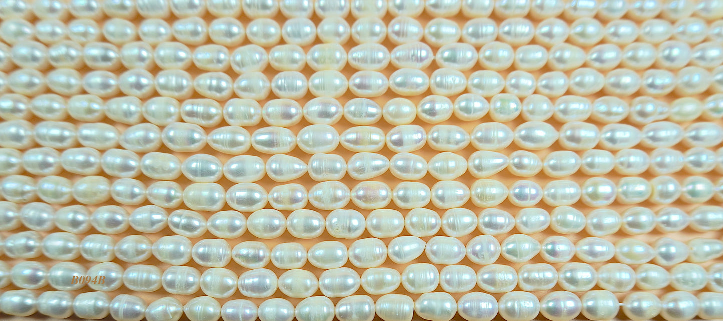 Freshwater pearl strands: white oval pearls 7-7.5x10mm