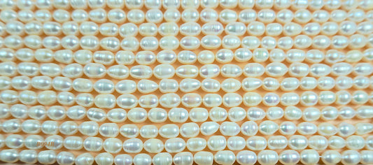 Freshwater pearl strands: white oval pearls 7-7.5x10mm