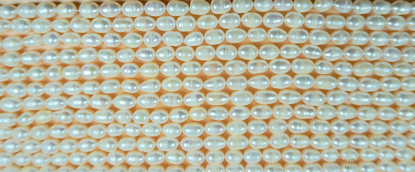 Freshwater pearl strands: white oval pearls 7-7.5x10mm