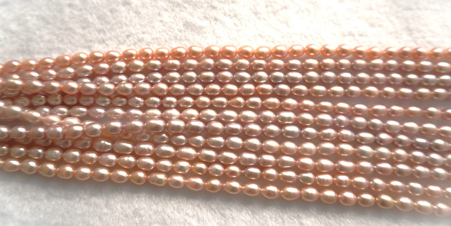 Freshwater pearl strands: pink oval 5.5-6×6.5-7.5mm lustrous rice pearls