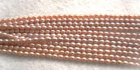 Freshwater pearl strands: pink oval 5.5-6×6.5-7.5mm lustrous rice pearls