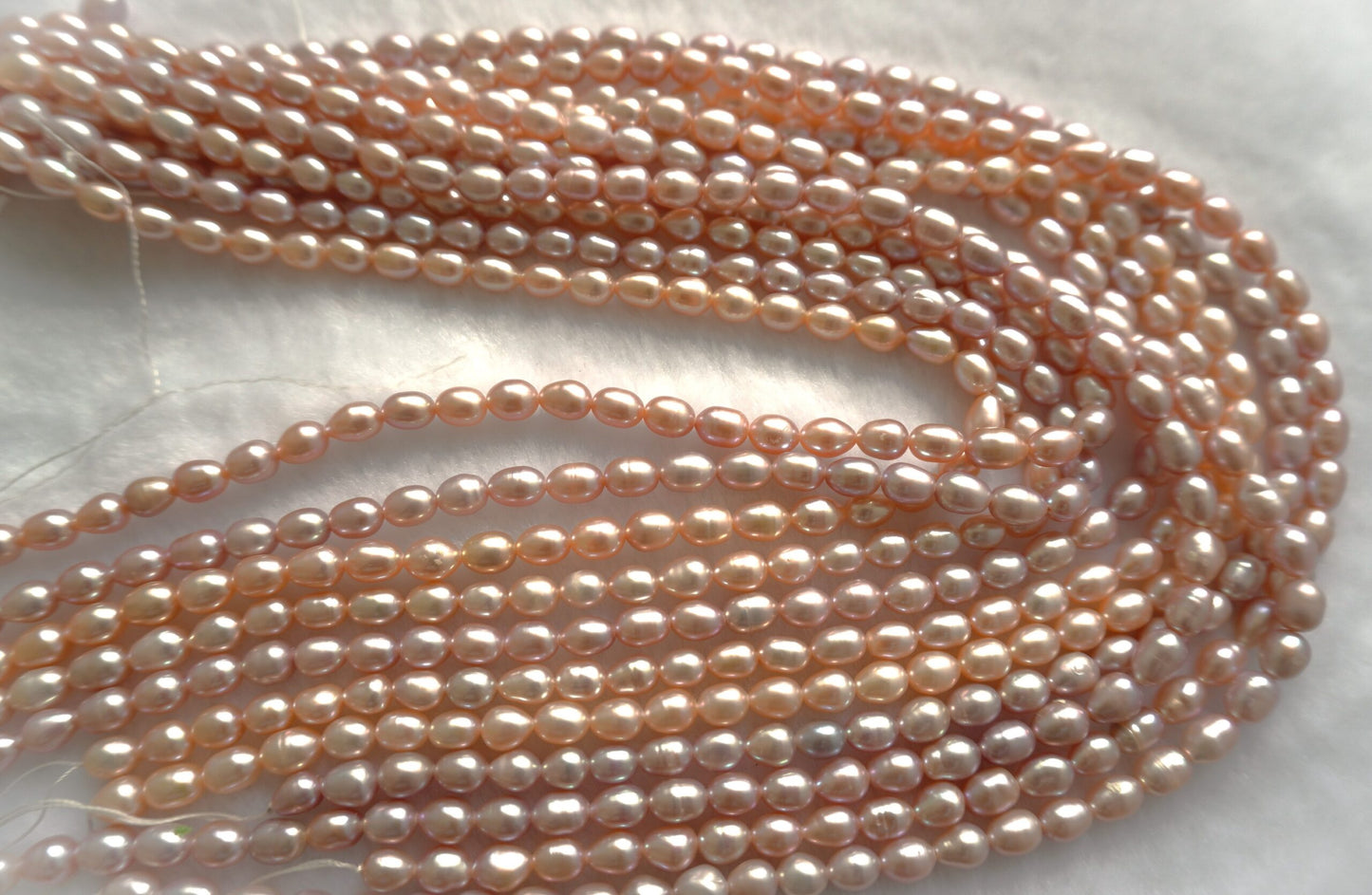 Freshwater pearl strands: pink oval 5.5-6×6.5-7.5mm lustrous rice pearls