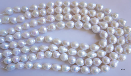 Freshwater pearl strands: Baroque white oval 12X10mm-14X10mm high grade
