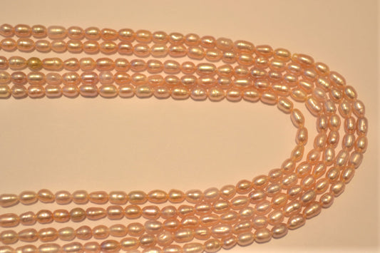 Freshwater pearl strands: pink oval 4-5mmx3mm small rice pearls