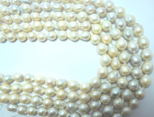 Freshwater pearl strands: Baroque white oval 10.5x13.5mm high grade