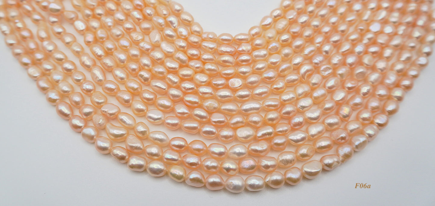 Freshwater pearl strands: orange semi-baroque 6-7×7-8mm irregular oval