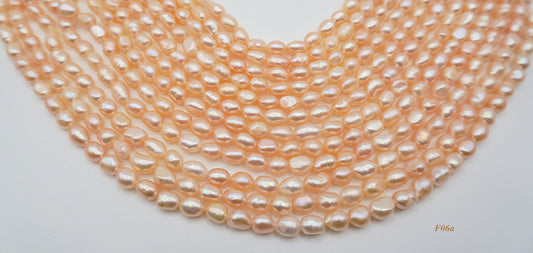 Freshwater pearl strands: orange semi-baroque 6-7×7-8mm irregular oval