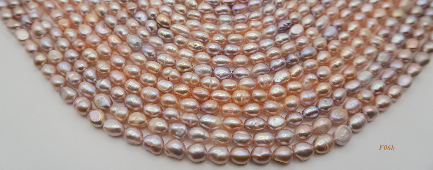 Freshwater pearl strands: pink/mauve semi-baroque 6-7×7-8mm irregular oval