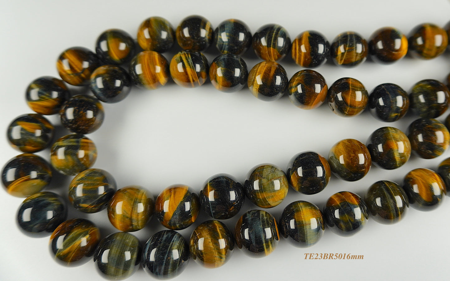 Tigers eye strands: Top grade natural brown/bluish round 16mm