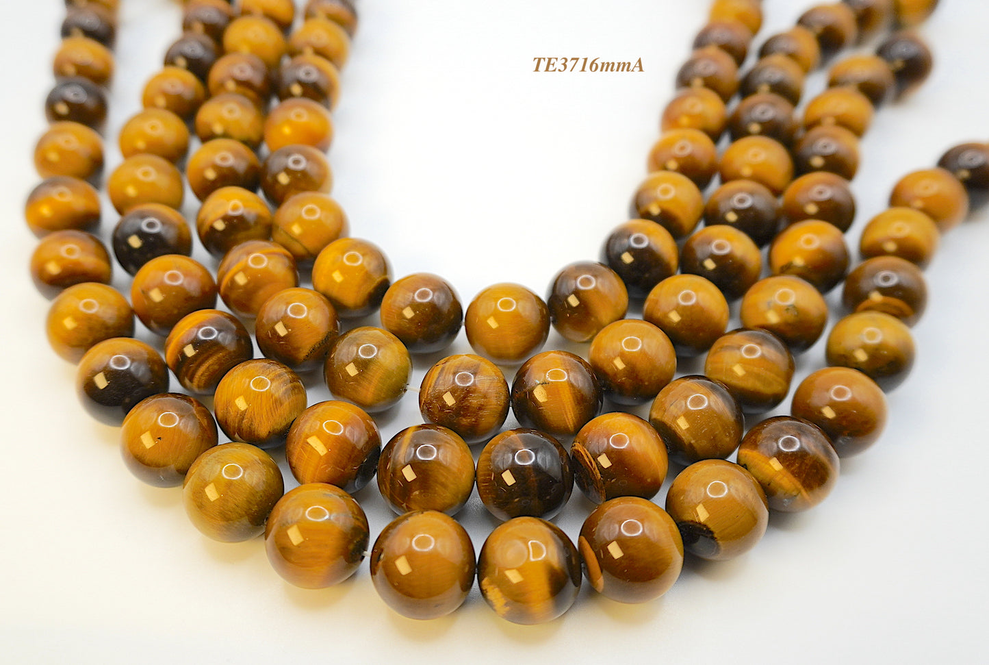 Tigers eye strands: Top grade natural brown round 16mm
