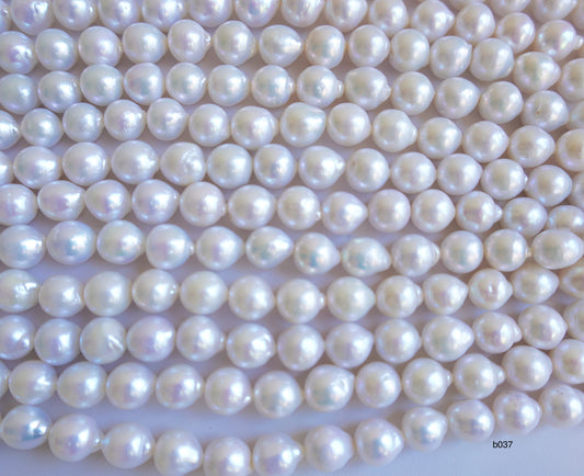 Freshwater pearl strands: Baroque white lustrous oval 13×11-11x10mm high grade