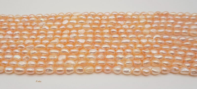 Freshwater pearl strands: orange semi-baroque 6-7×7-8mm irregular oval